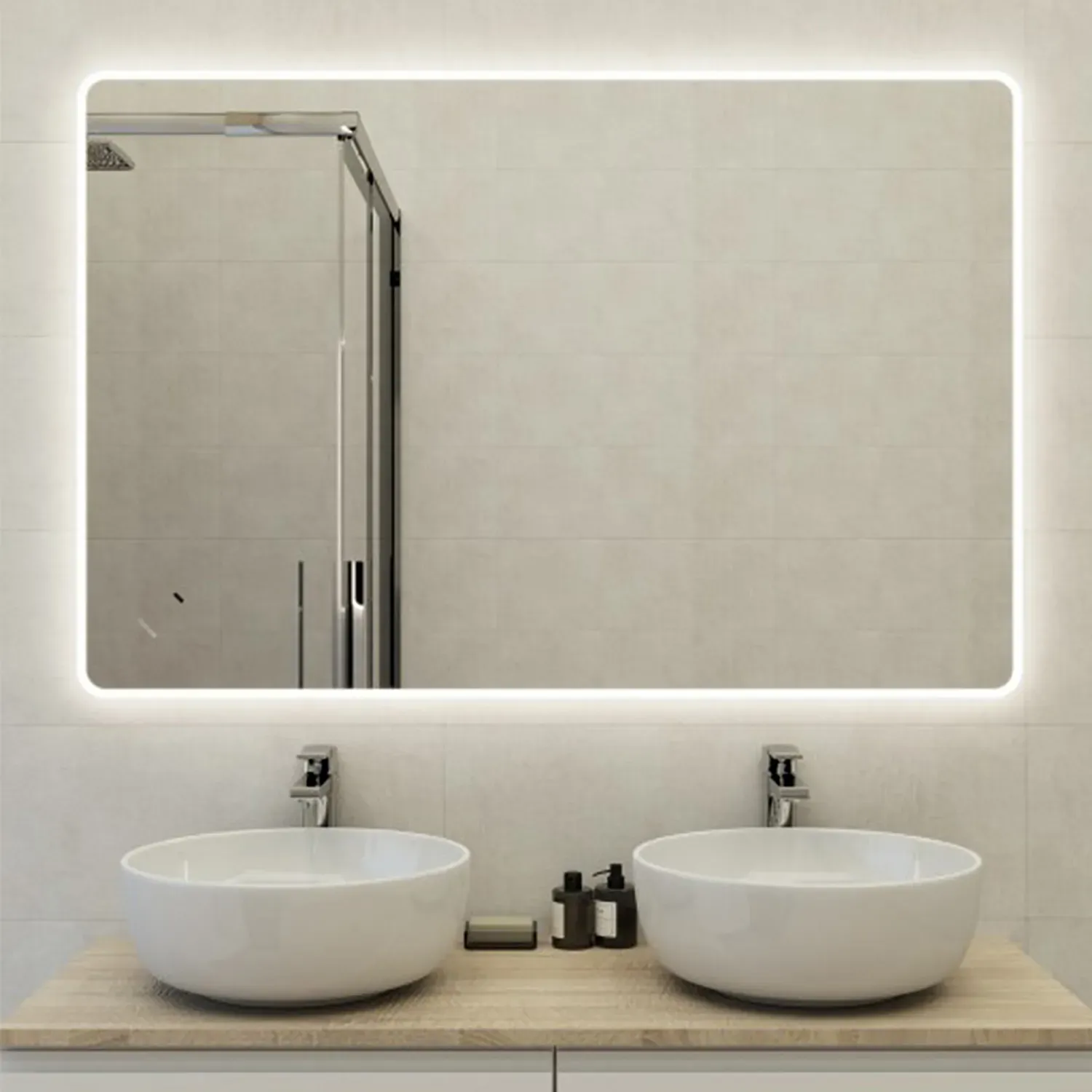 Modern bathroom with a large rectangular backlit LED mirror over two white vessel sinks.